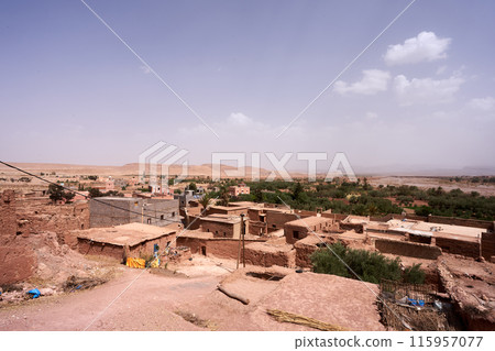 landscape with a field and winding road landscape with a field and winding road 115957077