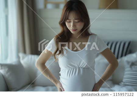 AI-generated image of a pregnant woman clutching her waist and grimacing in pain from lower back pain 115957122