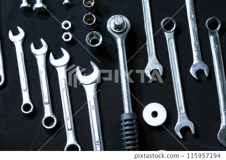 Hand Tools And Mechanics Wrenches Isolated On Black Workbench Surface 115957194