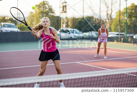 Portrait of emotional woman tennis player during friendly doubles couple match 115957309
