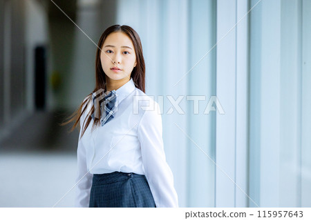 High school girl in a shirt looking back High school girl in a shirt looking back 115957643