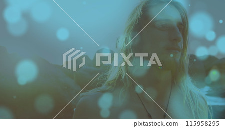 Caucasian young adult with long blonde hair standing outdoors 115958295