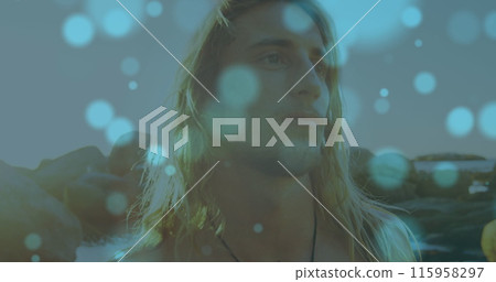 Caucasian young adult male with long blonde hair is looking thoughtful 115958297