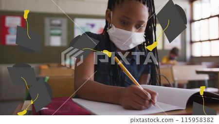 In school, African American student wearing mask is writing 115958382