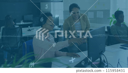 Diverse team working together, pointing at computer screen 115958431