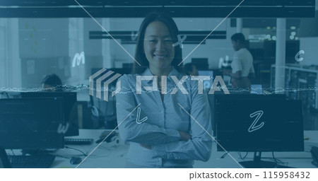 Asian senior manager standing with arms crossed in office 115958432