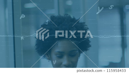 African American female intern looking down, focused on work 115958433