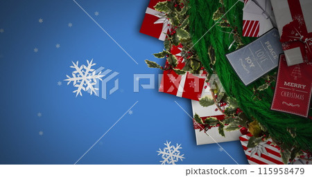 Snowflakes are falling on festive background with Christmas decorations Snowflakes are falling on festive background with Christmas decorations 115958479