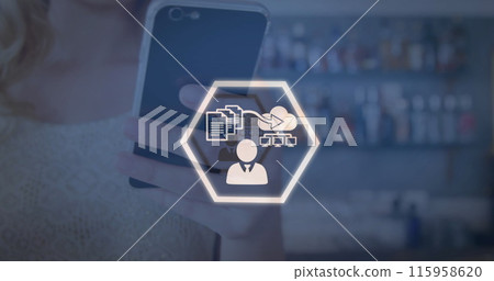Caucasian young adult holding smartphone with graphic overlay Caucasian young adult holding smartphone with graphic overlay 115958620