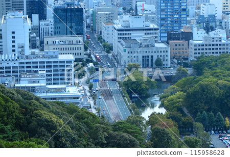Matsuyama Castle in Ehime Prefecture: View of the outer moat from the castle tower and Matsuyama City Hall (foreground left) Matsuyama Castle in Ehime Prefecture: View of the outer moat from the castle tower and Matsuyama City Hall (foreground left) 115958628