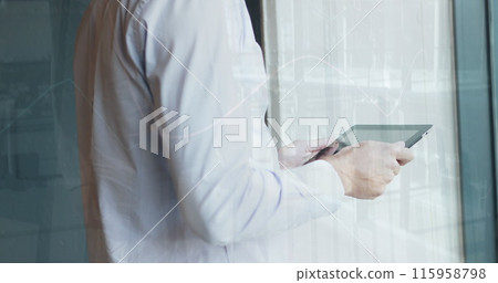 A person holding tablet, looking at screen 115958798