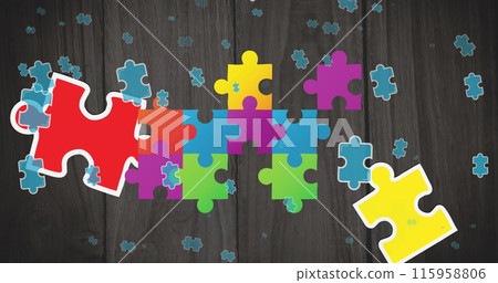 Colorful puzzle pieces are scattered and connecting on wooden surface 115958806
