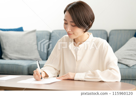 Woman writing a letter 115960120