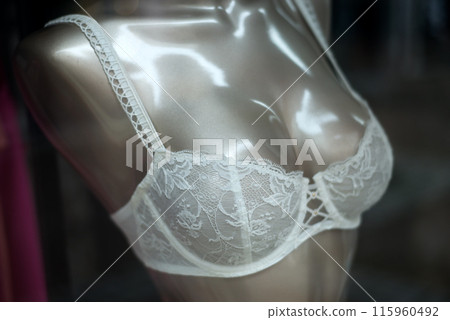 Closeup of white bra on mannequin in a fashion store showroom 115960492