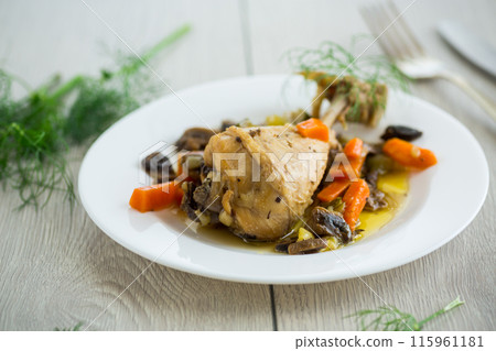 roast chicken with mushrooms and vegetables in a plate on a wooden table roast chicken with mushrooms and vegetables in a plate on a wooden table 115961181