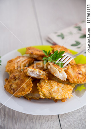 crispy golden fish fillet fried in batter crispy golden fish fillet fried in batter 115961183