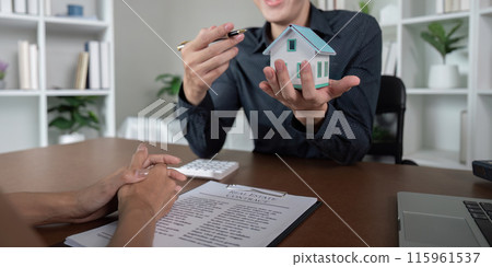 Real Estate Agent Signing Documents with Client for Buy or Sell a House, Contract Agreement, Home Purchase 115961537
