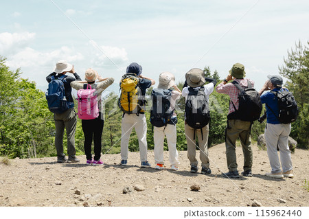 Men and women enjoying hiking Men and women enjoying hiking 115962440