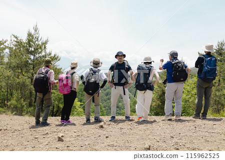 Men and women enjoying hiking Men and women enjoying hiking 115962525