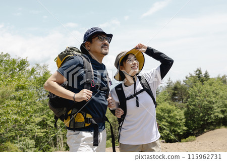 Parents and children enjoying hiking 115962731
