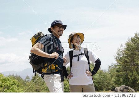 Parents and children enjoying hiking 115962738