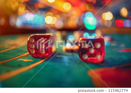 Two red dices on a casino table with bokeh background 115962774