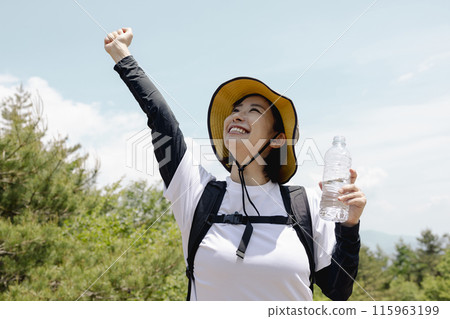 Woman enjoying hiking Woman enjoying hiking 115963199