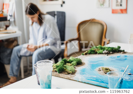 Artist Contemplating Her Next Steps in Selling Paintings and Crafts Artist Contemplating Her Next Steps in Selling Paintings and Crafts 115963762