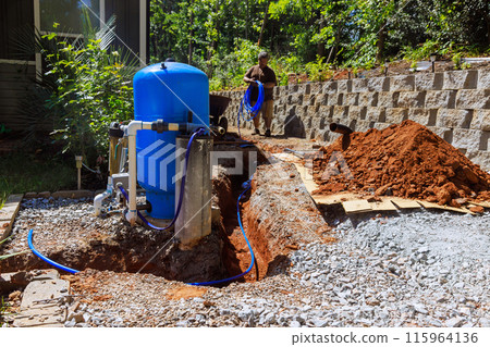 In trench, PVC pipe is ready to connect to home well water system In trench, PVC pipe is ready to connect to home well water system 115964136
