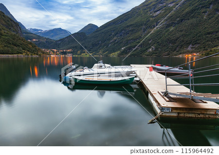 Boats Docked on Calm Geirangerfjord in Norway 115964492