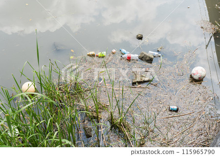 Discarded plastic bottles and other rubbish floating in a river after a typhoon or heavy rain Discarded plastic bottles and other rubbish floating in a river after a typhoon or heavy rain 115965790