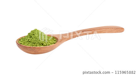 matcha green tea powder in wood spoon on white background 115965882