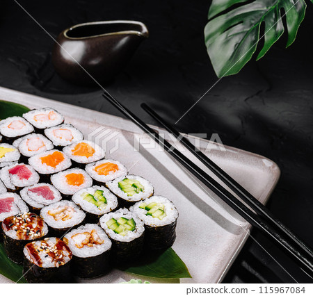 Assorted sushi platter on dark background 115967084