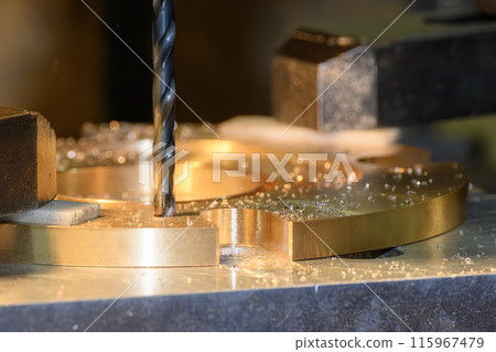 The hole drilling  process on NC milling machine with brass material parts. 115967479
