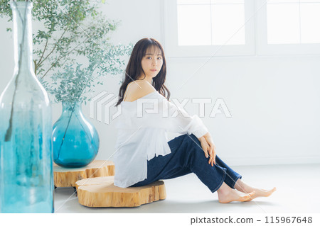 A woman relaxing in the room A woman relaxing in the room 115967648