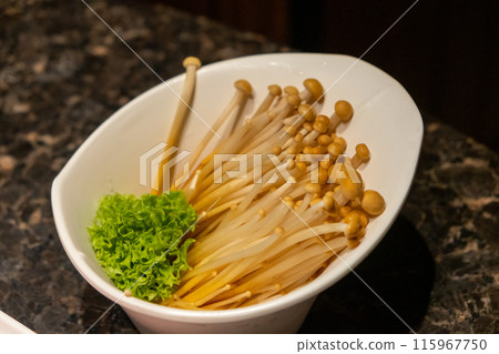 Golden Needle Mushroom served in a bowl Golden Needle Mushroom served in a bowl 115967750