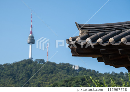 Traditional Korean roof in Namsangol Hanok village, with view of N Seoul Tower or Namsan Tower in Seoul, South Korea. 115967758