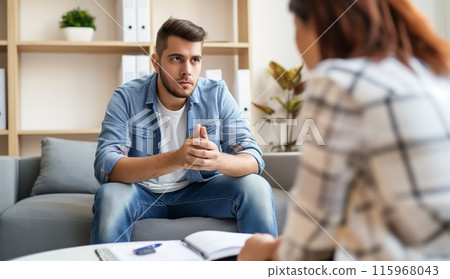 Male Patient Sitting on Couch in Office 115968043