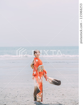New adults walking along the beach New adults walking along the beach 115968253
