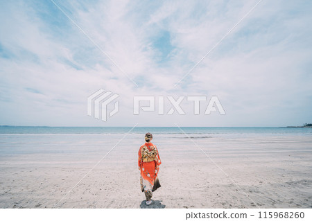 New adults walking along the beach 115968260