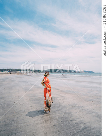 New adults walking along the beach New adults walking along the beach 115968265