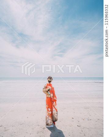 New adults walking along the beach in their best clothes 115968332