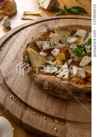 Delicious artisanal four cheese pizza 115968819