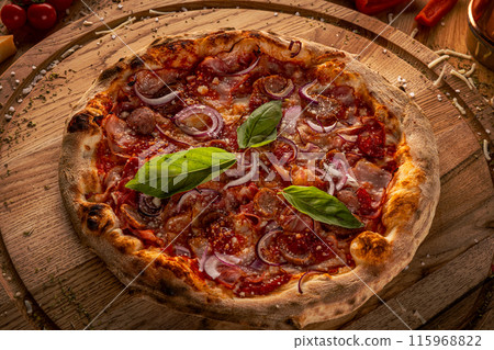 Homemade pizza on wooden board 115968822