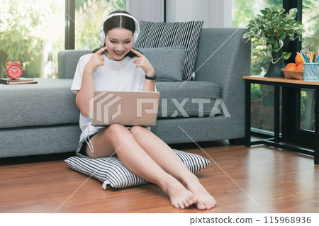 Pretty teenage girl pretending to be cute kiku in video conference at her home. Webinar, social distancing, e learning and seminar online Concept. 115968936