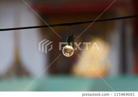 A light bulb hanging on the railing. A light bulb hanging on the railing. 115969081
