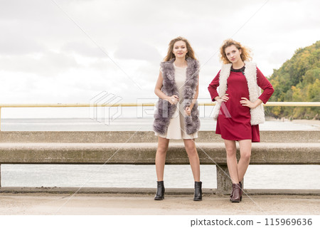 Two fashionable women outdoor Two fashionable women outdoor 115969636