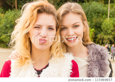 Two fashionable women outdoor 115969657