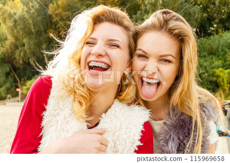 Two crazy women having fun outdoor 115969658