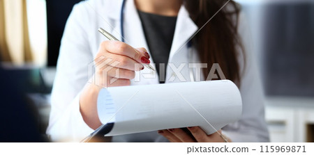 Female doctor hand hold silver pen filling 115969871